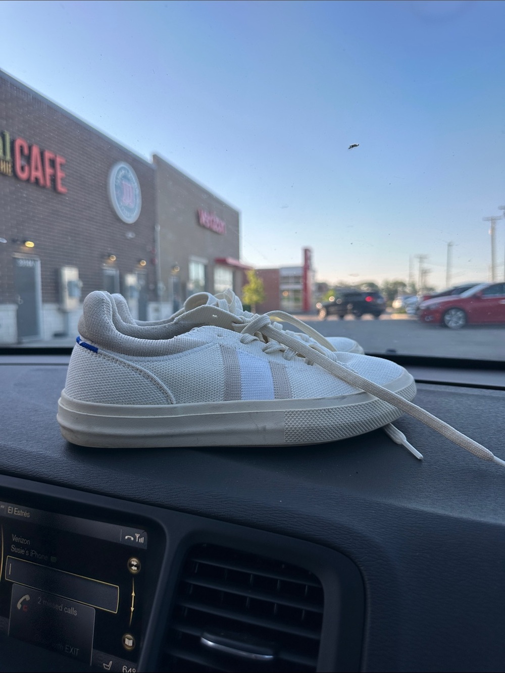 Rothy’s Off-White Canvas Low-Top Sneakers with Blue Heel Tab